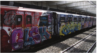 A train slathered in graffiti awaits passengers at the Basilica San Paolo station in Rome. Graffiti is such a load on resources for municipalities that some have developed their own protocols. Photo courtesy of Clemensfranz via Wikimedia Commons